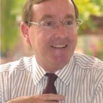 Head and shoulders colour photo of Charles Humfrey, in a striped shirt and tie